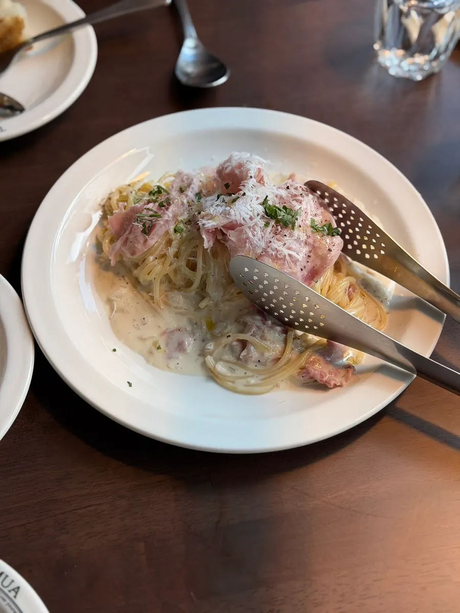 THE MUA's cream pasta topped with handmade jambon