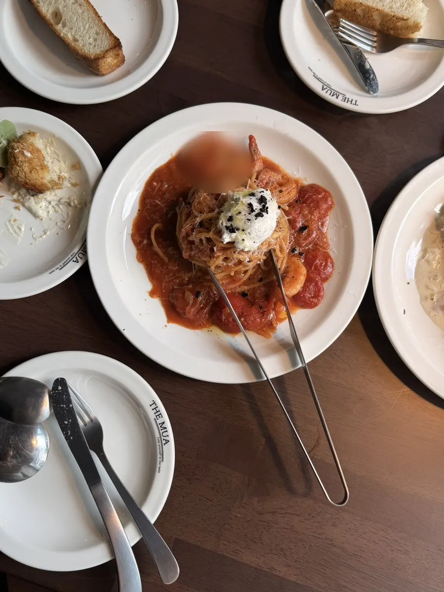 A plate of THE MUA's shrimp ricotta pomodoro pasta