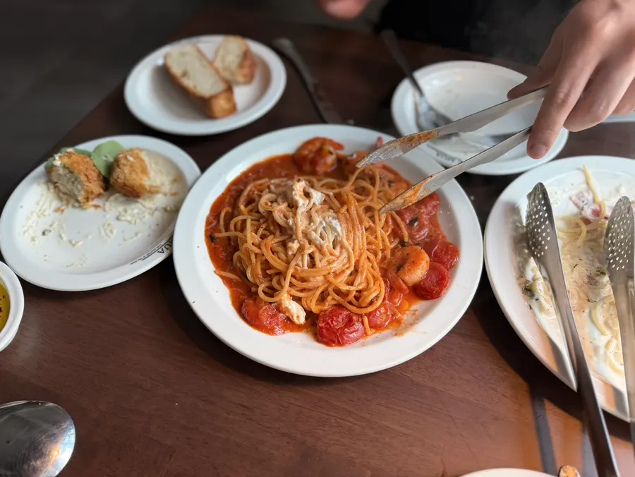 Tomato pasta mixed with ricotta cheese