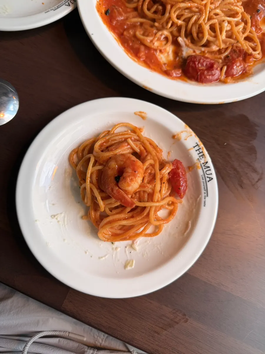 Shrimp ricotta pomodoro pasta twirled on a fork