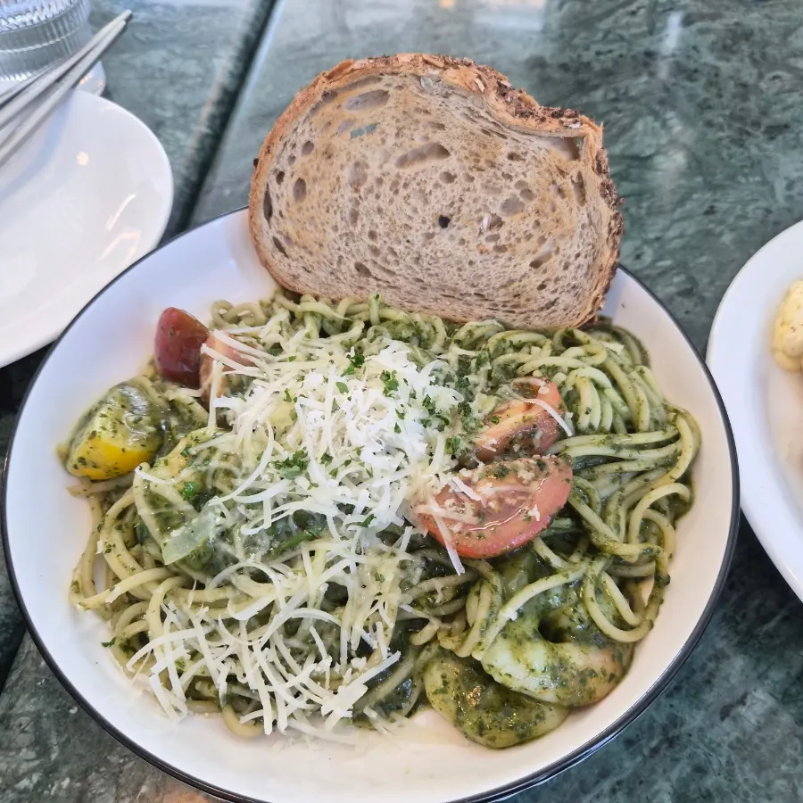 A plate of shrimp basil pesto pasta