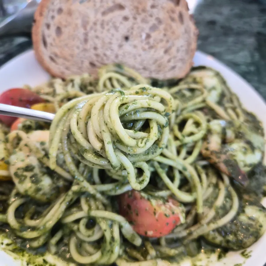 A piece of bread served with the pasta