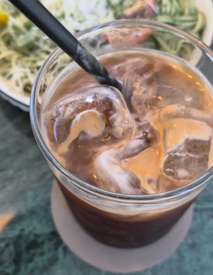 A glass of iced Americano at When You Bite