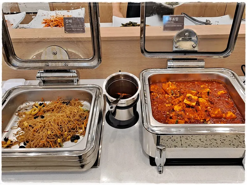 Japchae and braised tofu at the self-serve bar