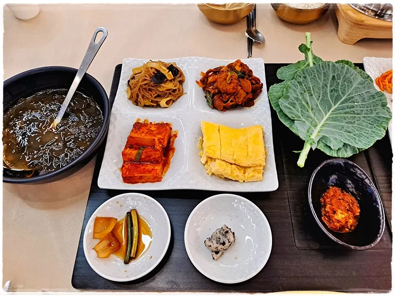 Plate with japchae, jeyuk bokkeum, and braised tofu