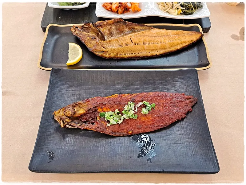 Two plates of hearth-grilled atka mackerel and seasoned mackerel