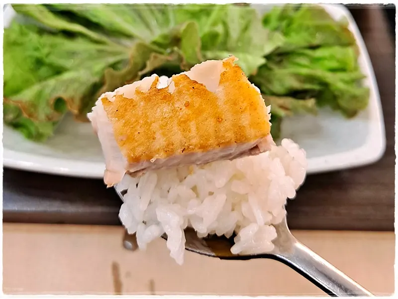 A piece of atka mackerel placed on top of rice