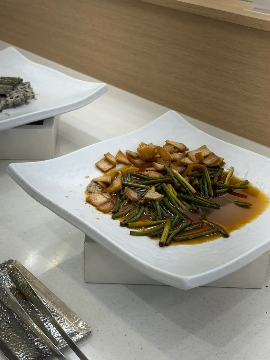 A variety of Korean side dishes at the self-serve bar