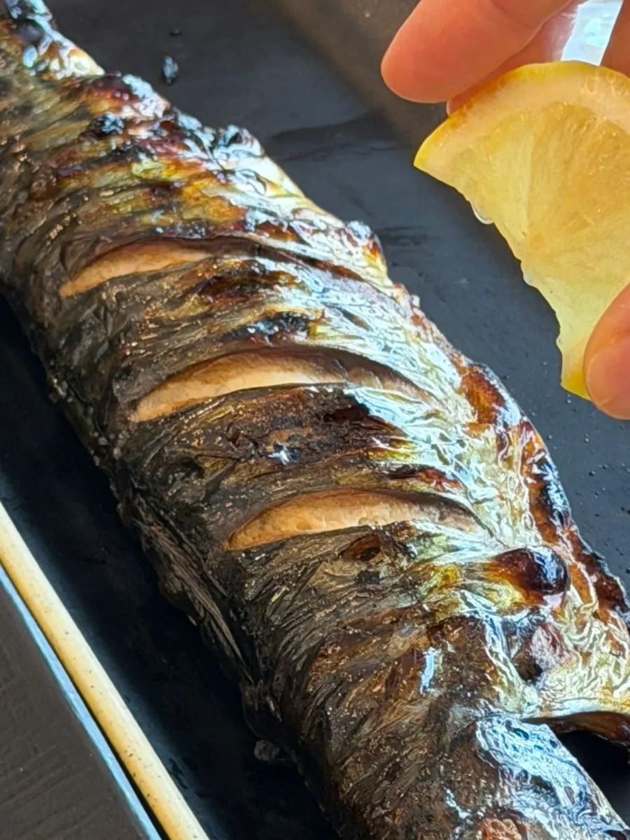 A clean, savory flake of grilled mackerel