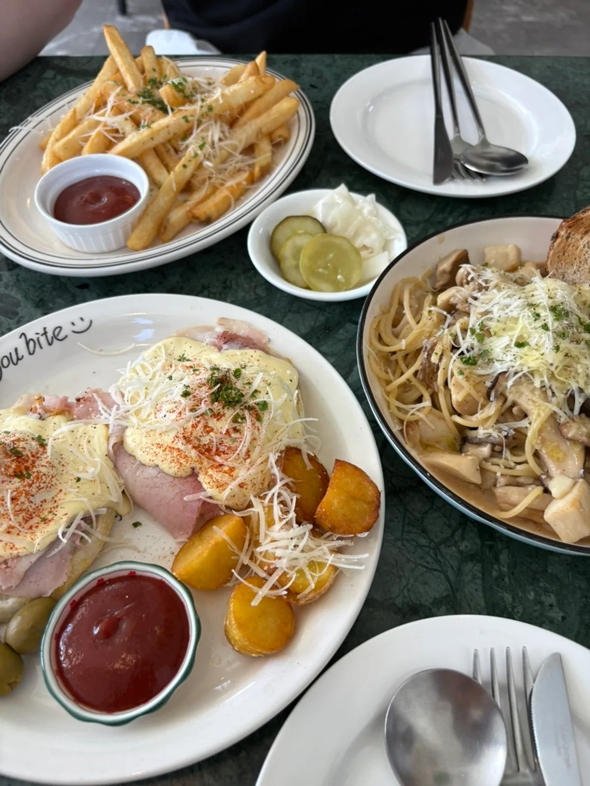 Brunch dishes on a teal marble table
