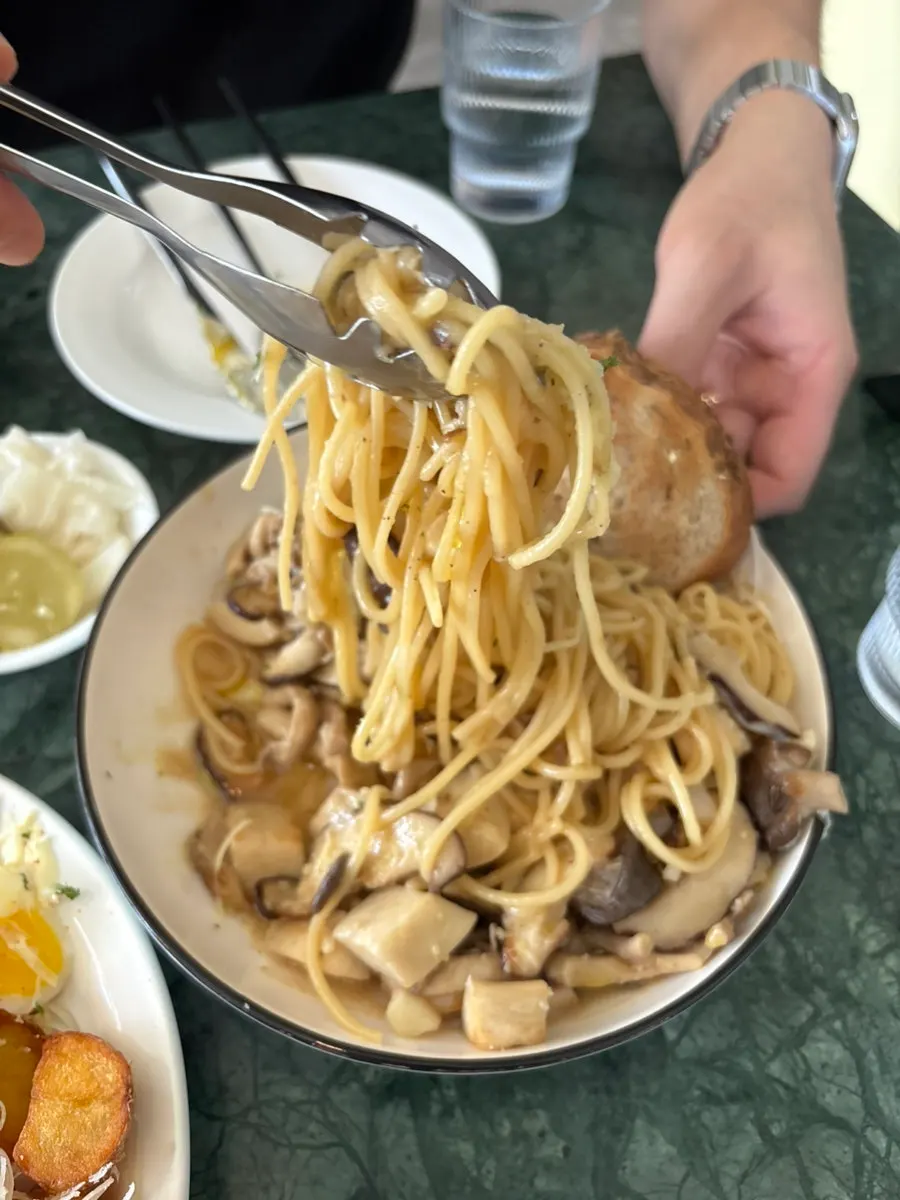 Eggs Benedict with French fries on the side