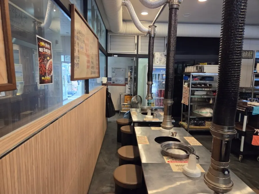 Interior view of tables at Tannae Paju Main Branch