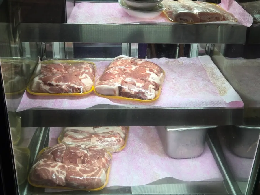 Plate of thick raw selected pork neck and pork belly