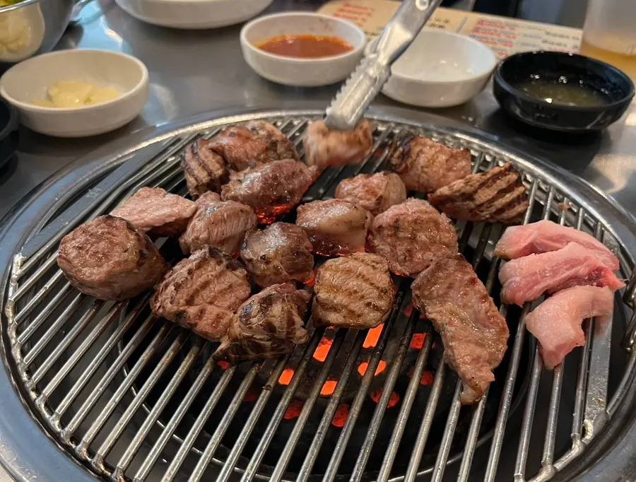 Close-up of plump grilled pork neck