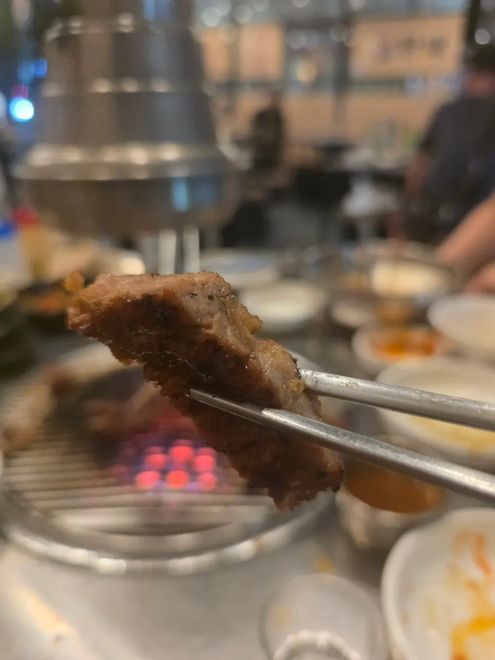 A tender, well-grilled piece of marinated pork king gui