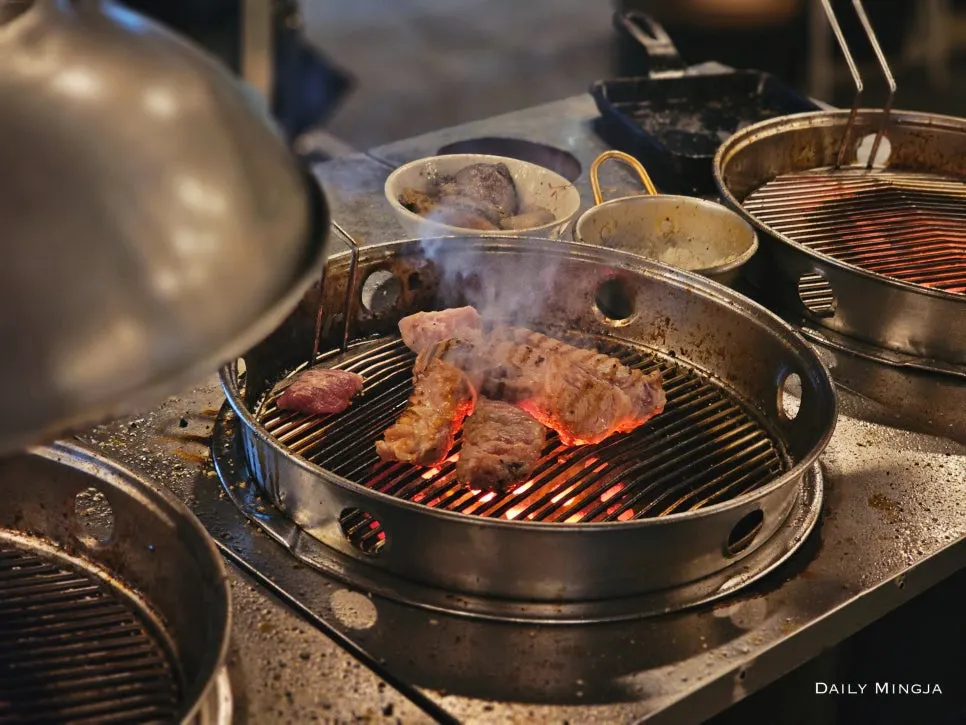 Tannae's aged meat placed on the tabletop grill
