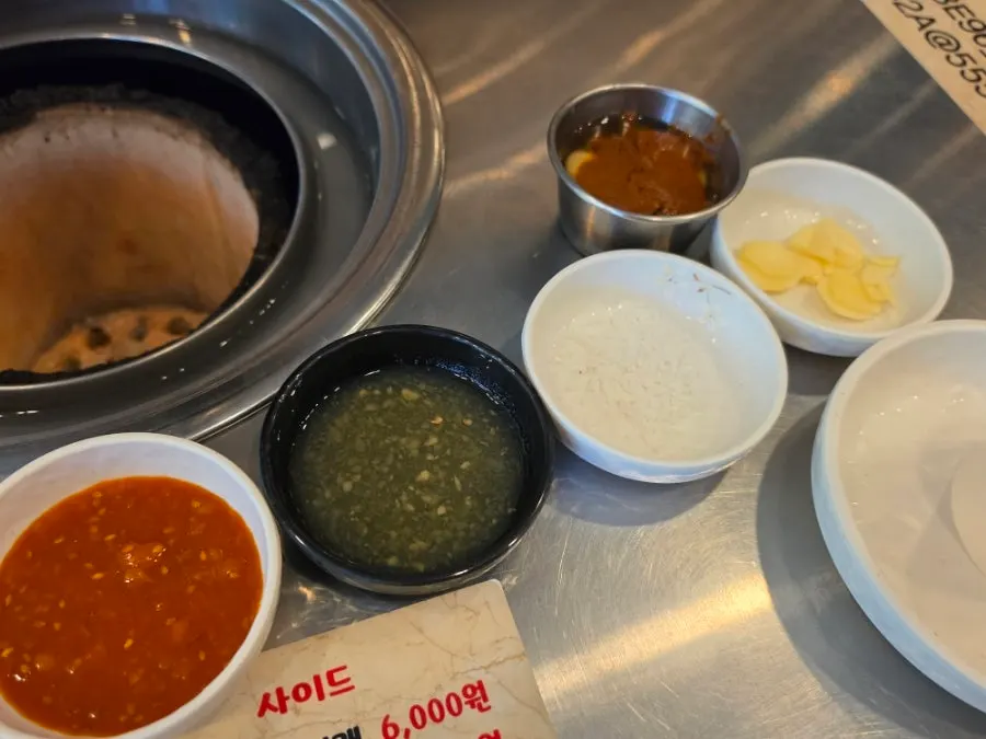 Individual ssamjang, garlic sauce, and salt setup