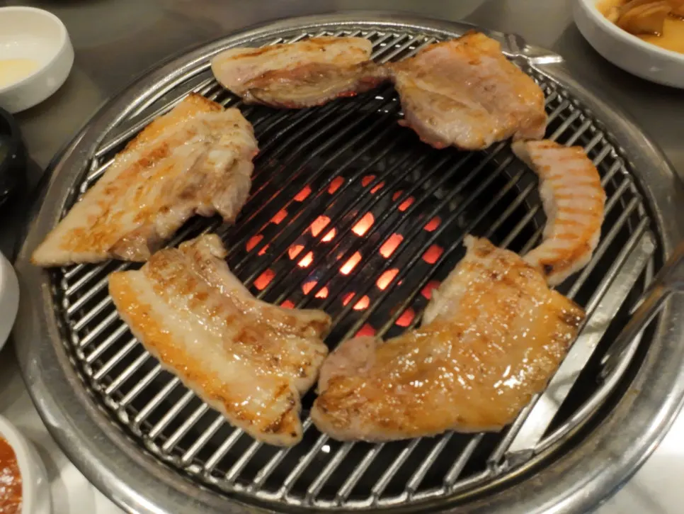 Cross-section of pork belly with a smoky char