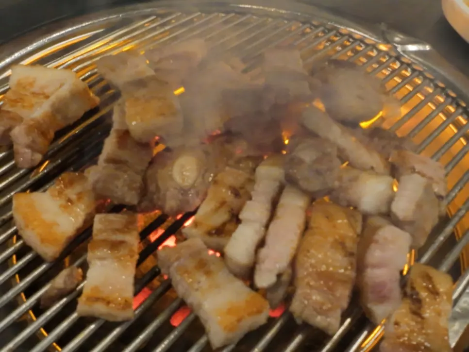 Meat grilled over high heat on the charcoal brazier