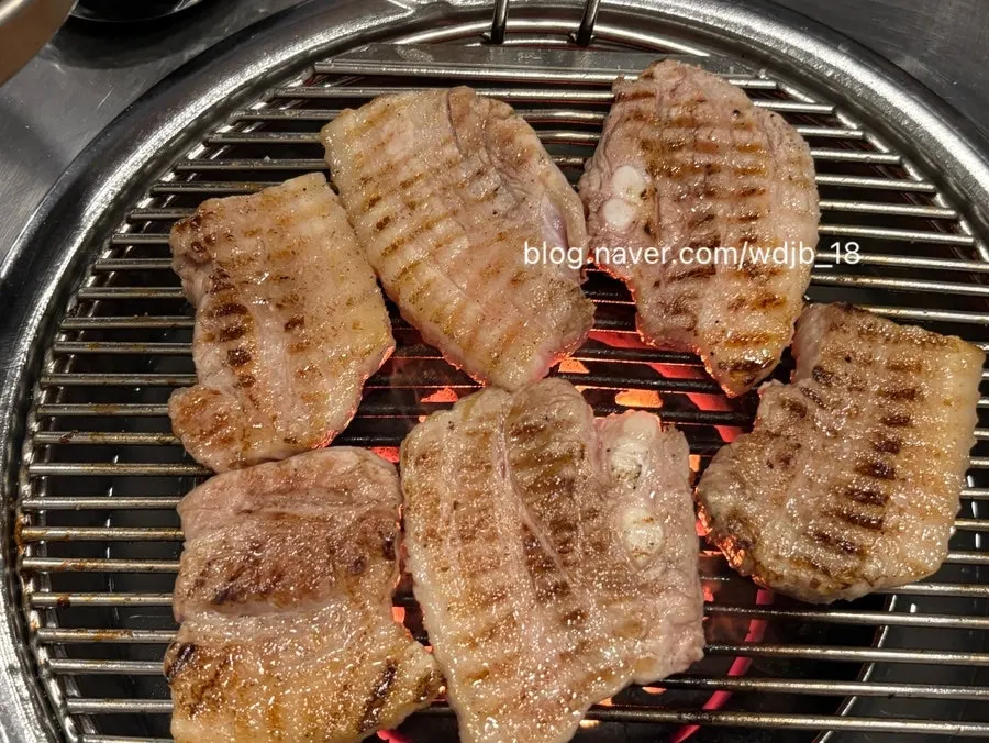 Two servings of pork belly on a plate