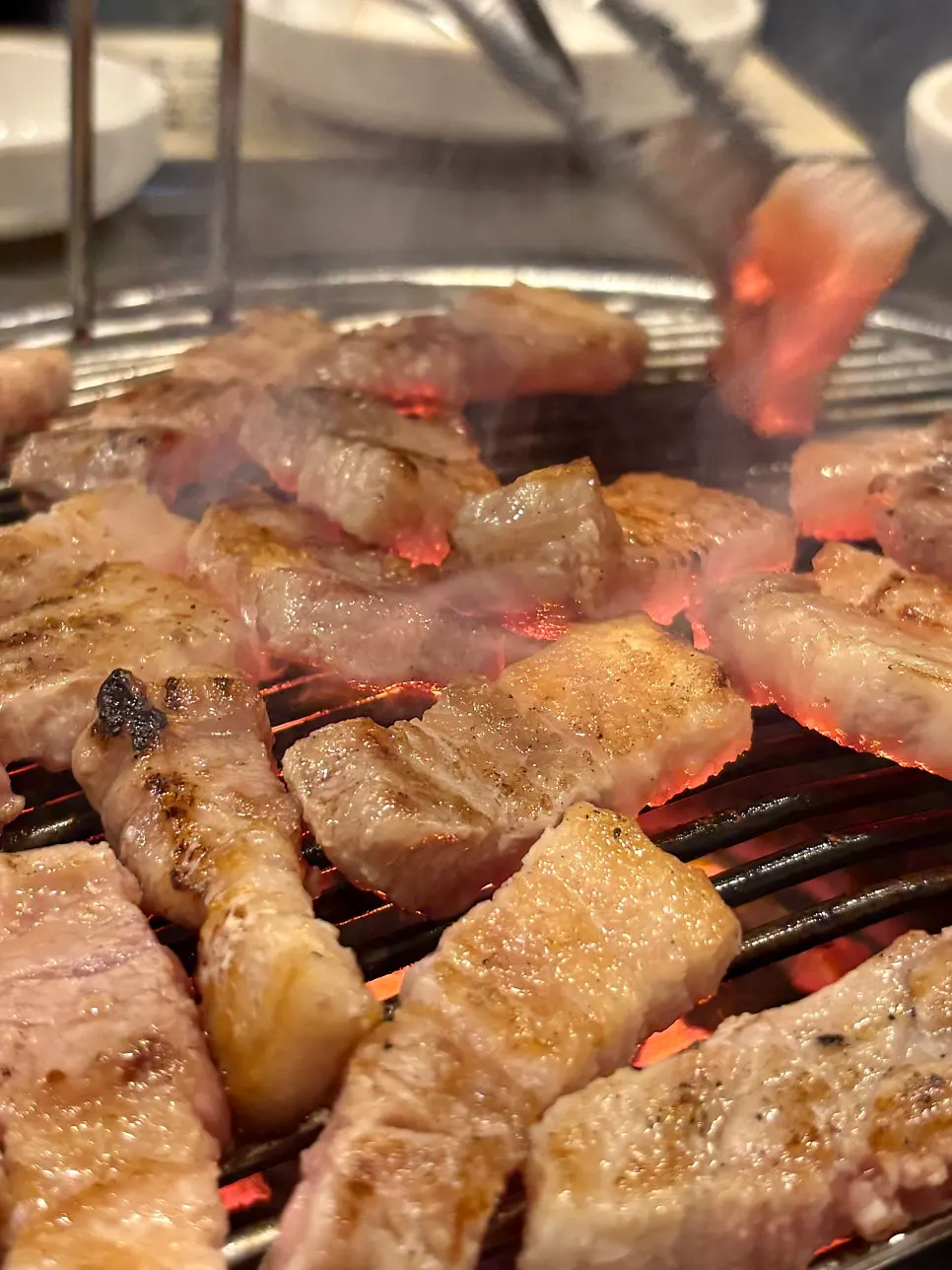 Close-up of charcoal-grilled pork belly