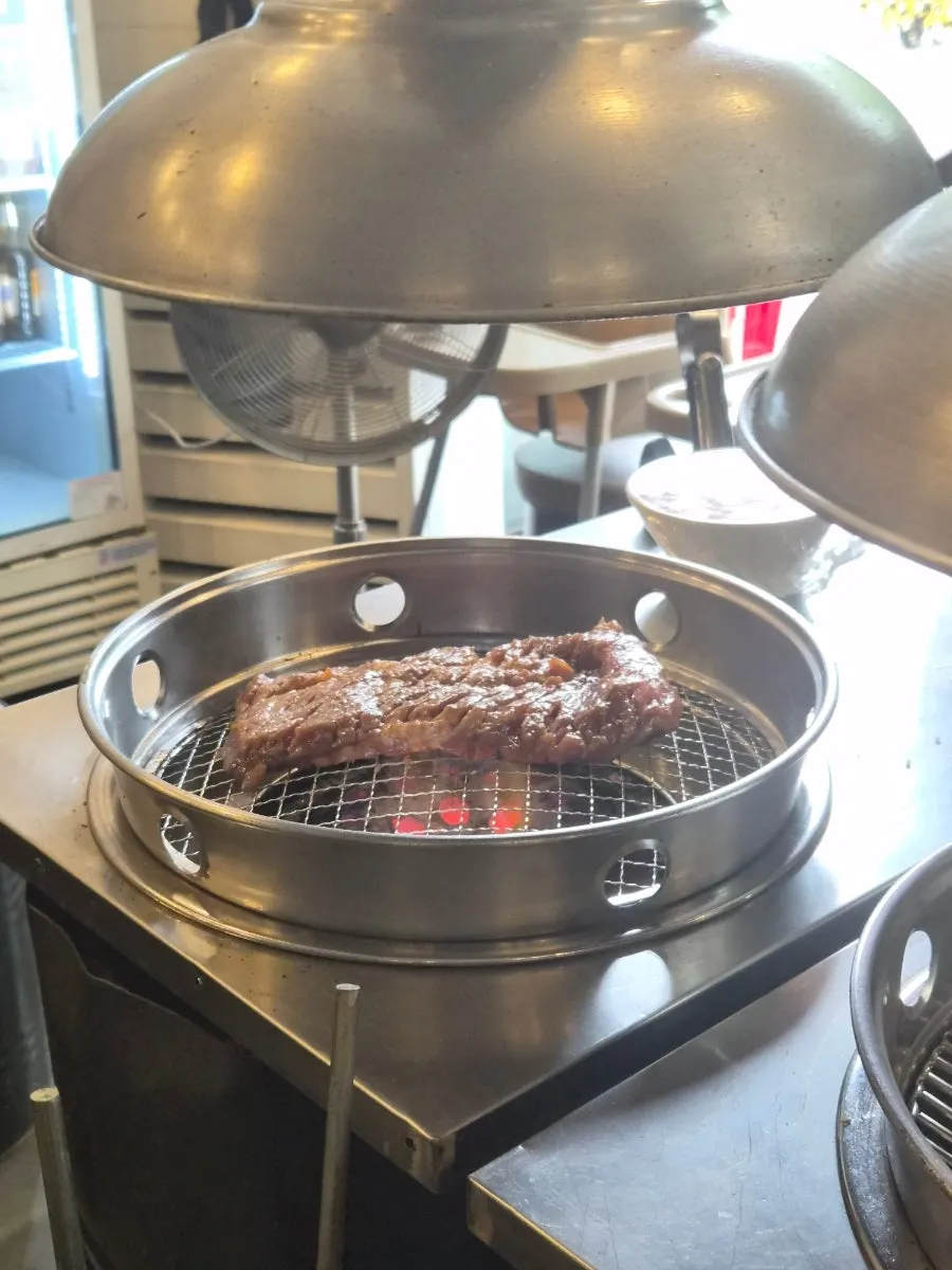 The charcoal pre-grilling station in the middle of the restaurant