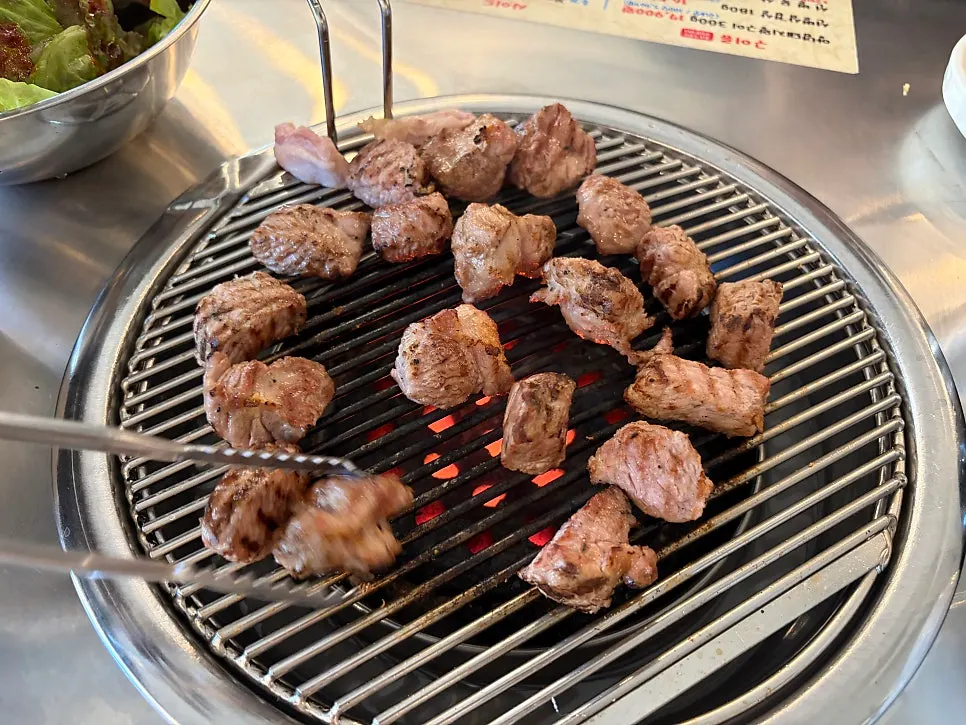 Selected pork neck placed on the charcoal grill