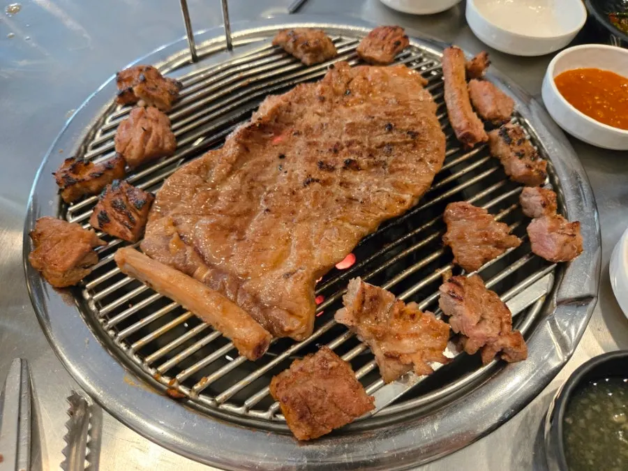 A fully grilled piece of marinated pork king grill