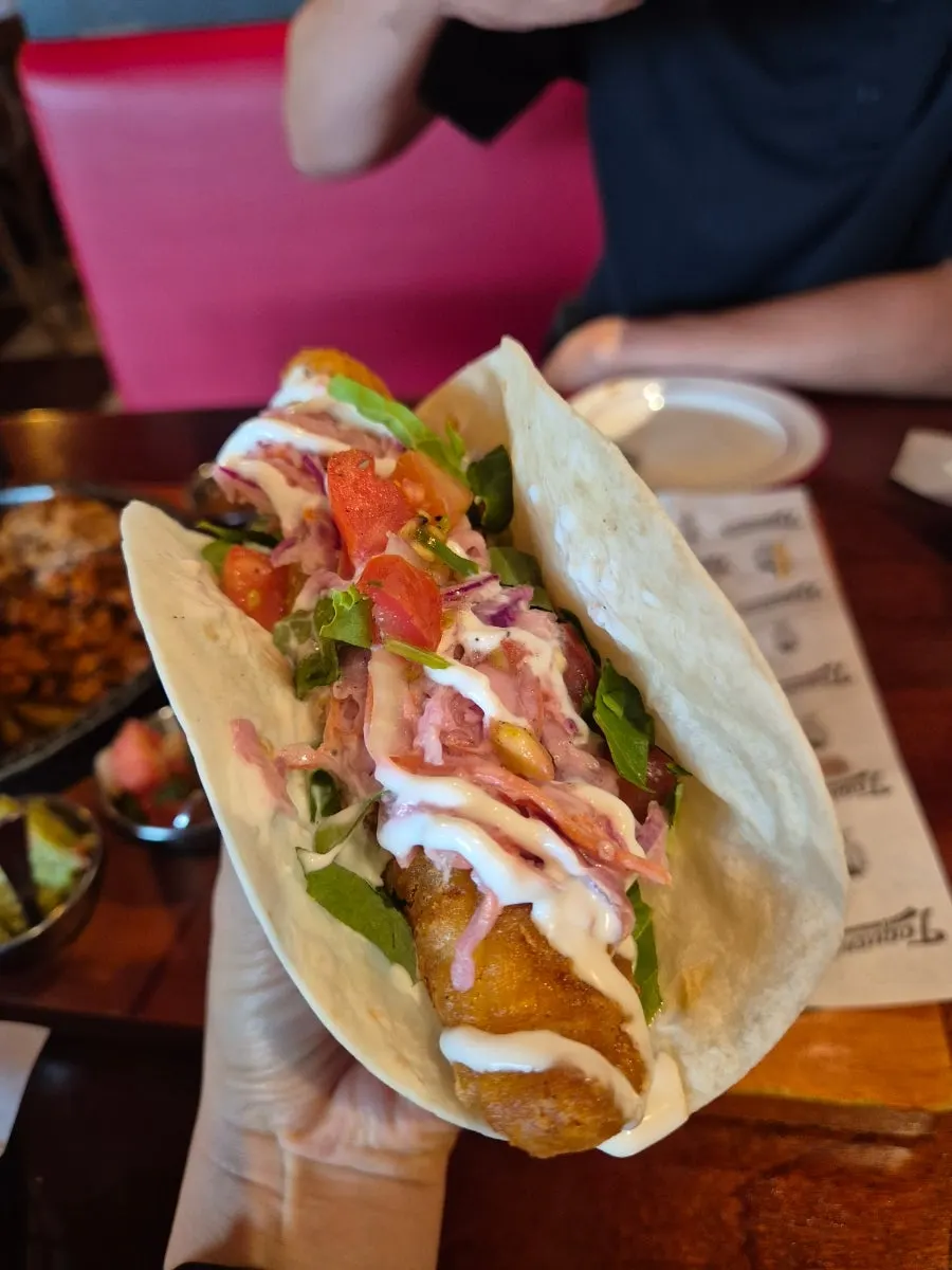 Holding up a taco