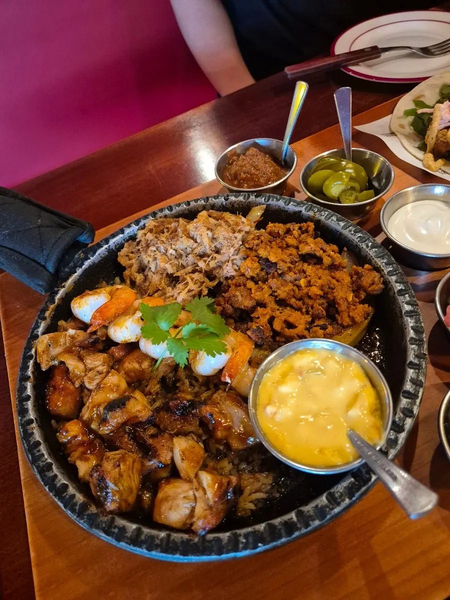 Fajita served on a sizzling pan