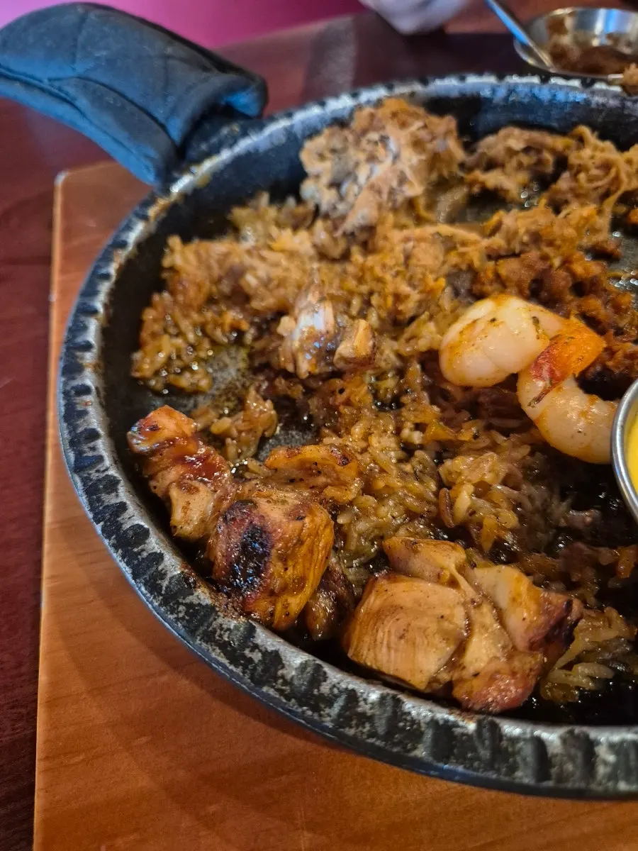 Crispy fajita rice pressed onto the bottom of the pan