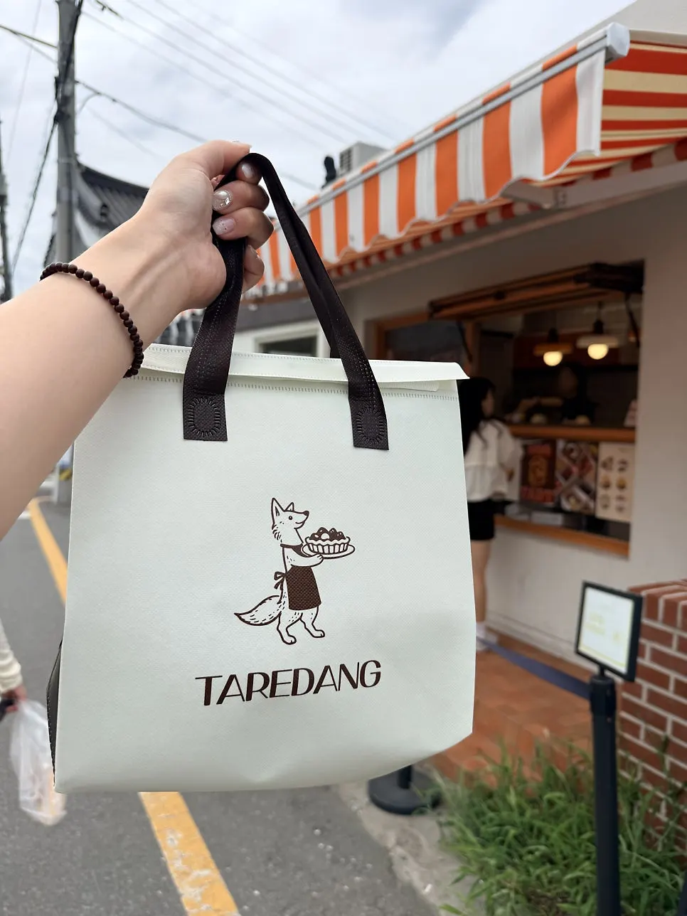 Holding a Tareudang fruit mochi
