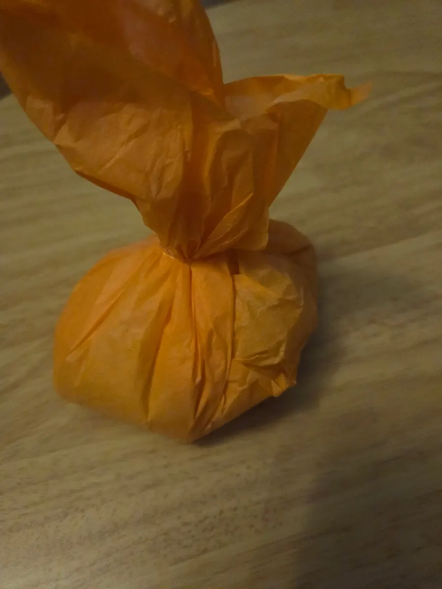 Tareudang mango mochi in orange packaging