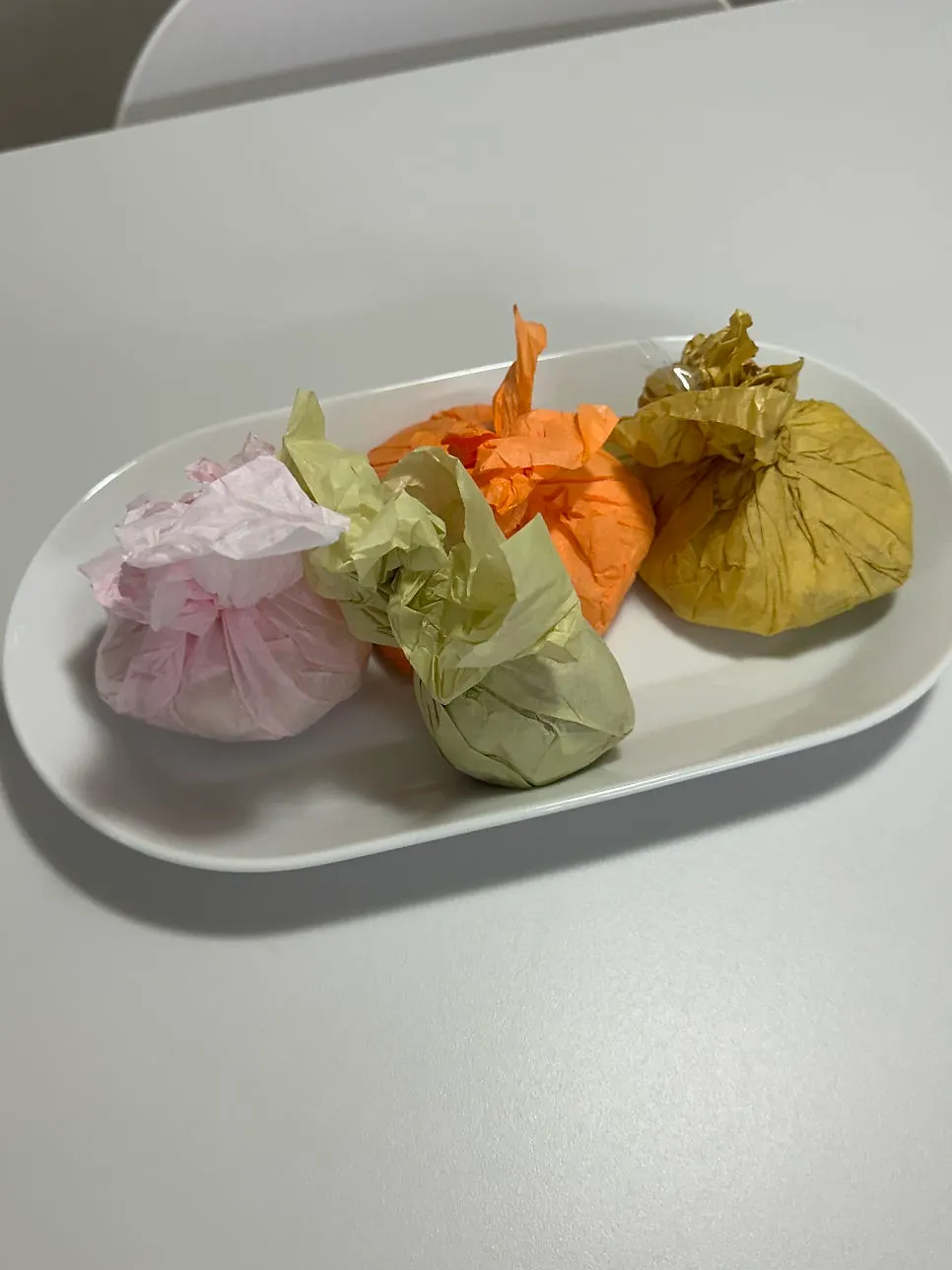 Tareudang mochi wrapped in different colors per flavor