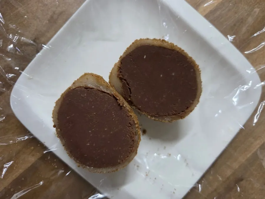 Raw chocolate mochi with a visible bite mark
