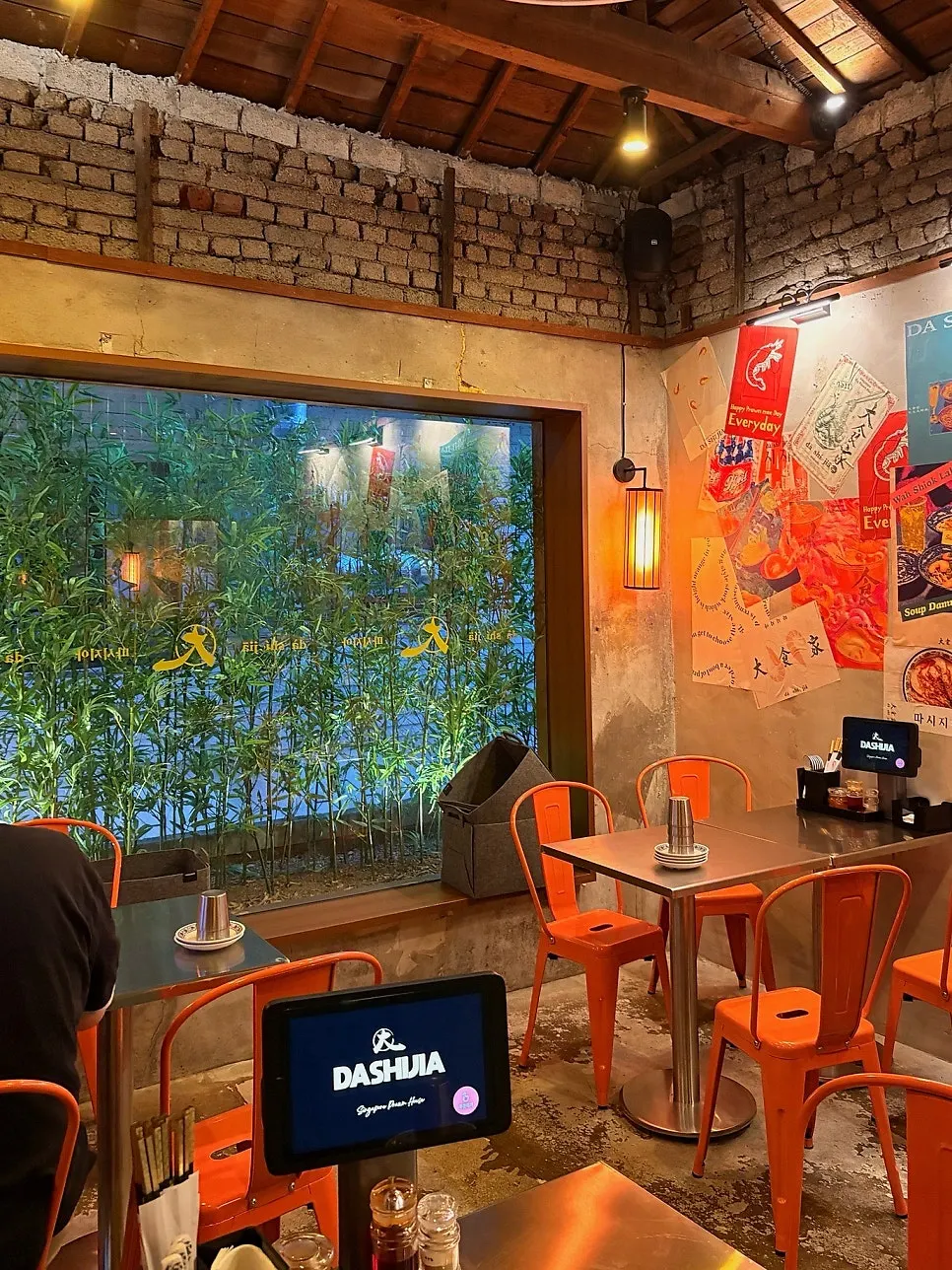 Interior seating at Ttasijia Yeonnam with lighting on