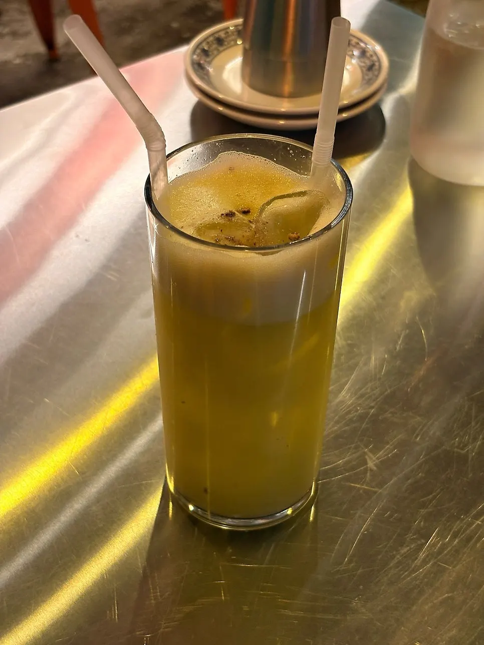 100% fresh-pressed apple juice topped with plum