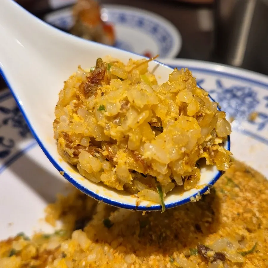 A spoonful of shrimp fried rice