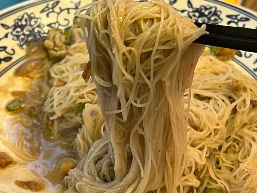 A generously portioned plate of shrimp broth fried noodles