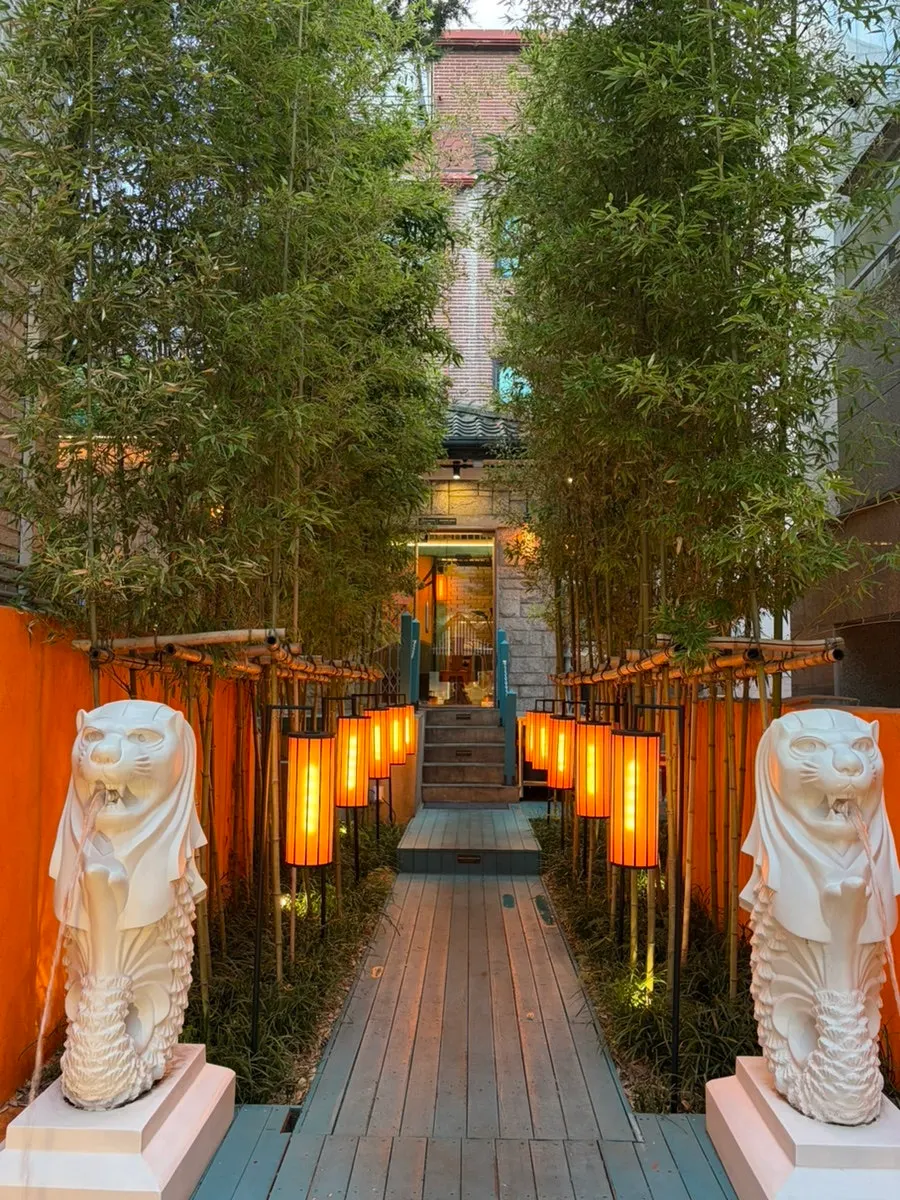 Ttasijia Yeonnam exterior with orange lighting and bamboo decor