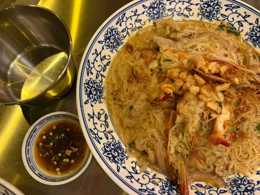 Shrimp broth fried noodles topped with large shrimp