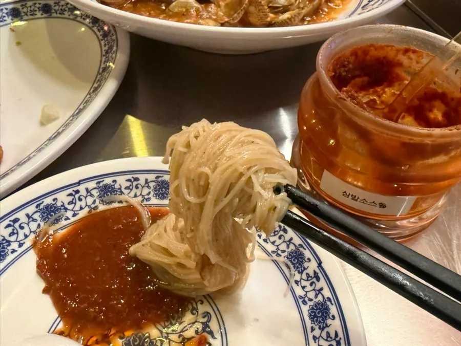 Sambal sauce on the table next to the fried noodles