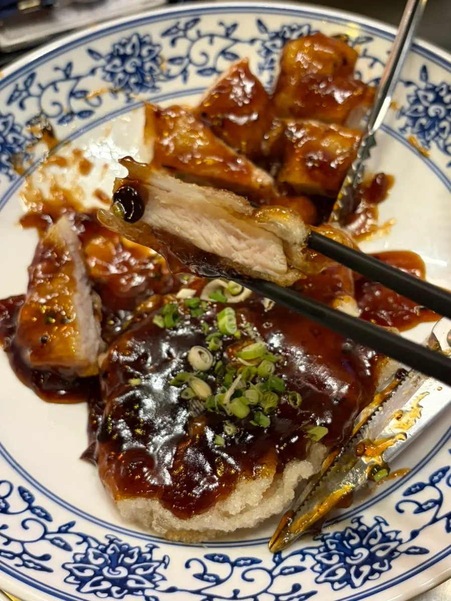 Cross-section of crispy black vinegar sweet and sour pork