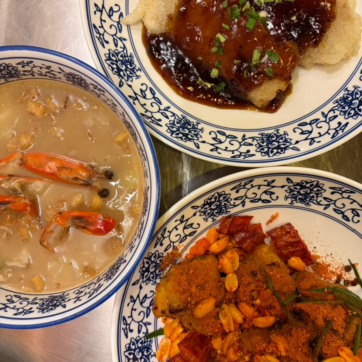 Table spread with shrimp gukbap, sweet and sour pork, and mala chicken
