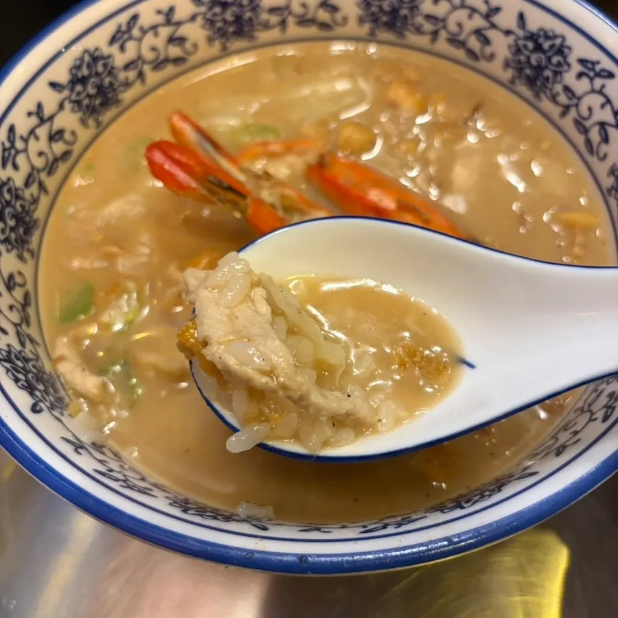 A spoonful of shrimp gukbap broth