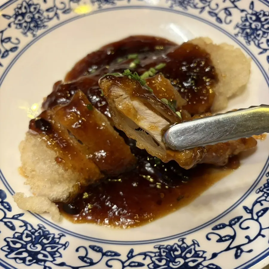 Sweet and sour pork coated in black vinegar sauce
