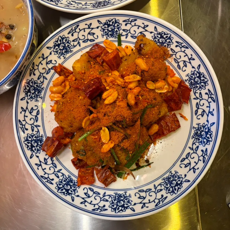 Picking up a piece of sweet and sour pork