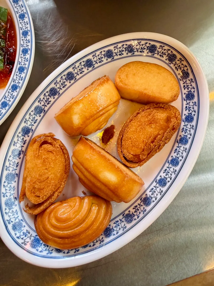 Fried mantou dipped in chili sauce