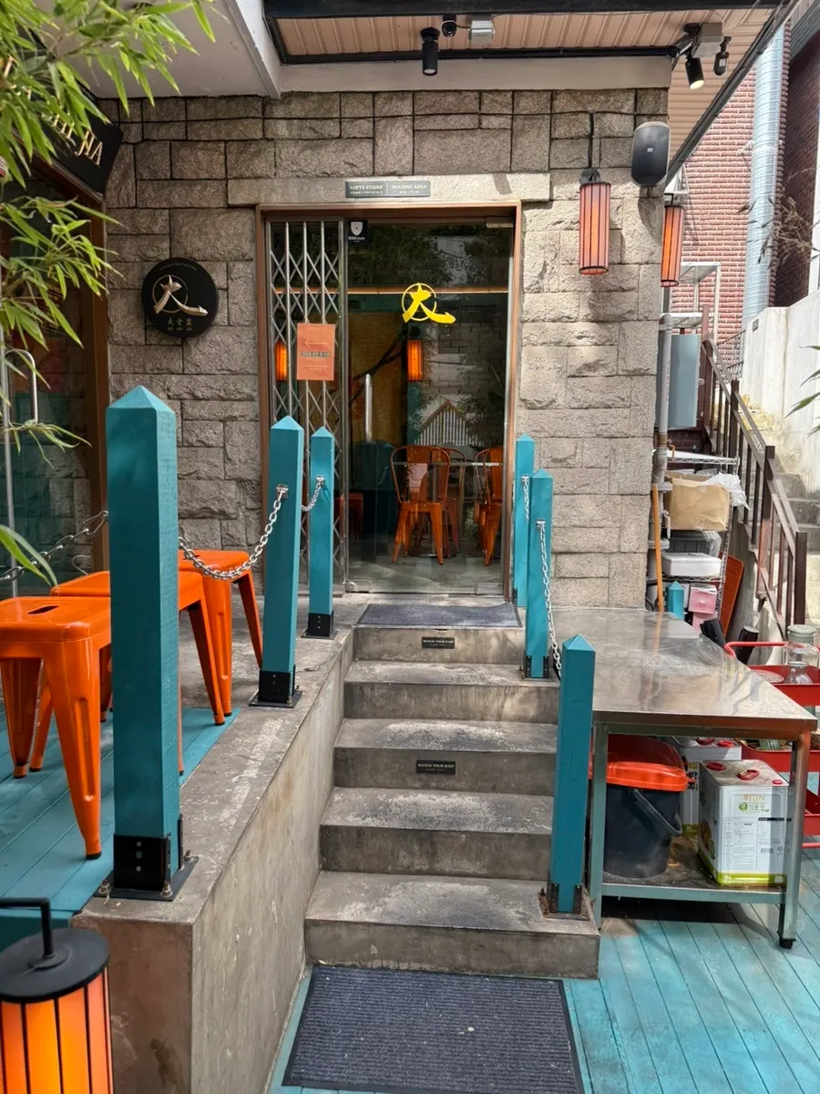 Bamboo-lined path from the entrance into the restaurant