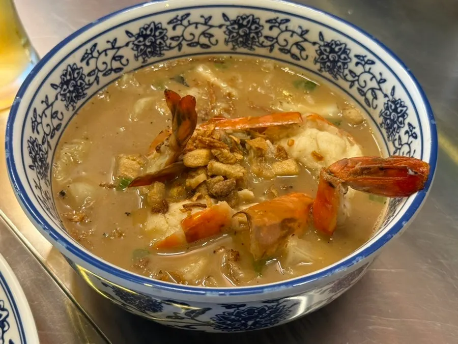 Close-up of noodles lifted from the shrimp broth fried noodles